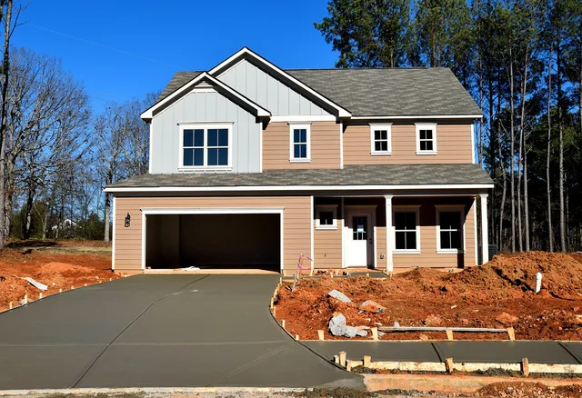 house, family, architecture, suburb, roof, window, home, facade, driveway, wood, porch, door, garage, exterior, outdoors, brick, residential, real estate, luxury home, nature, building, modern, new, construction, sky, front, style, design, grass, property, city, concrete. Garage door service insurance: coverage explained and priced