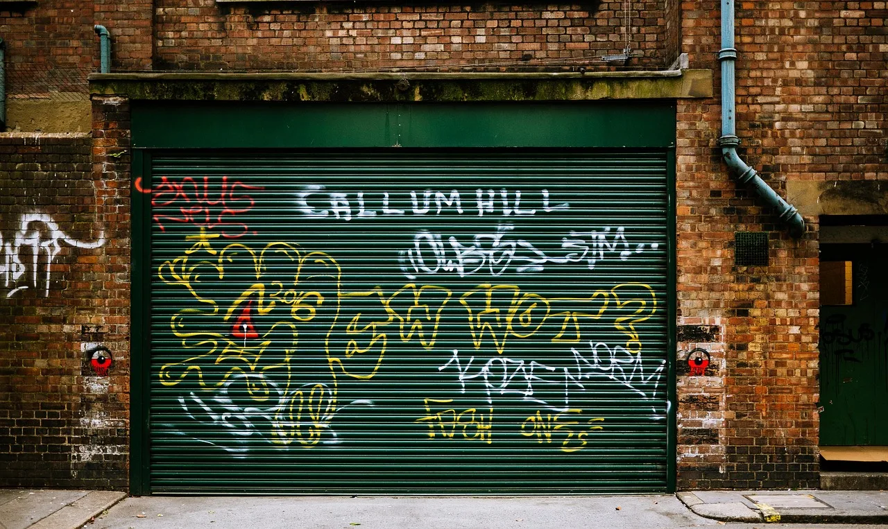 art, brick, brick wall, building, door, drawings, garage door, graffiti, overhead door, pavement, vandalism, wall, brick wall, garage door, garage door, garage door, garage door, garage door, graffiti, graffiti, vandalism, vandalism. What garage door service software should measure